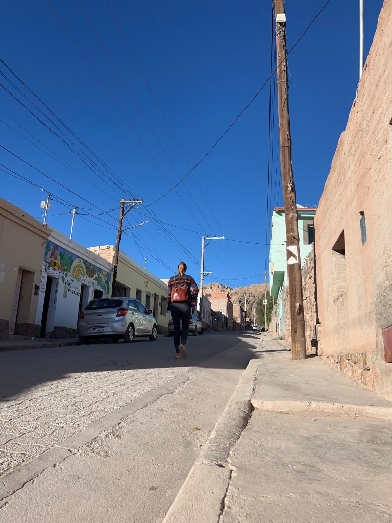 Nicki is walking up Rivadavia Street to find the start of the hike to La Garganta Del Diablo
