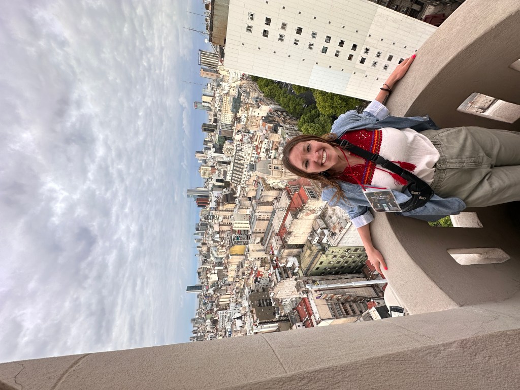 Nicki stands on one of the balconies at the Palacio Barolo in Buenos Aires