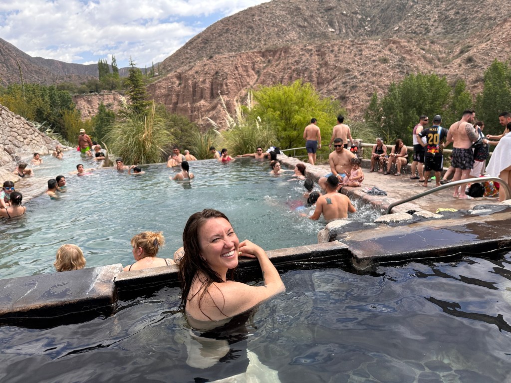 Nicki smiles at the camera while in a bath at the Mendoza hot springs