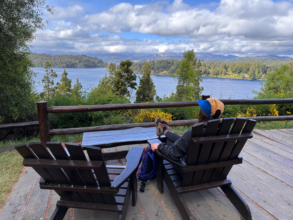 Nicki sits on a deck chair at the Patagonia cerveceria, Patagonia brewery, just outside of Bariloche, one of the best cities in Argentina.