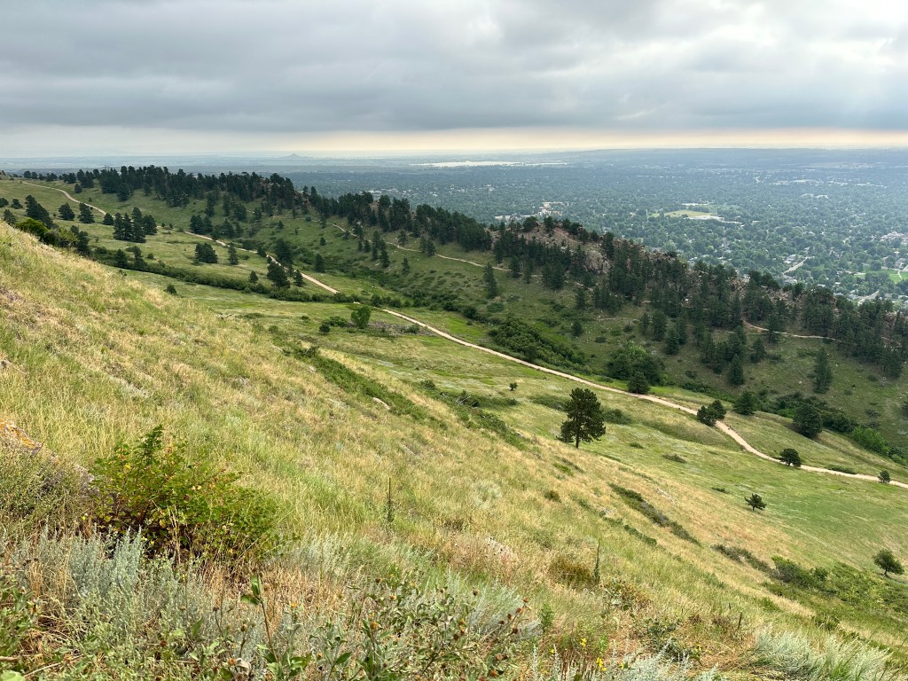 From the Mount Sanitas Trail, you can look down into the Sanitas Valley. In the distance you can see the Dakota Ridge Trail and the East Ridge Trail.