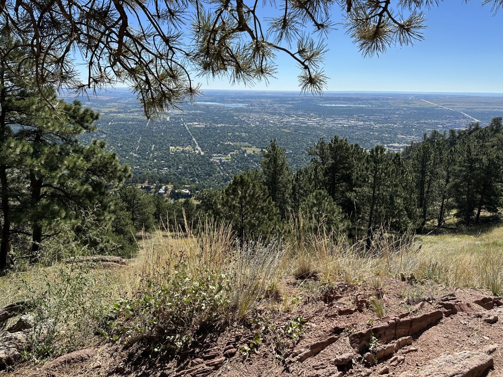 Looking down at a view over Boulder along the Lion's Lair Trail