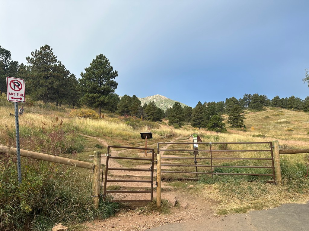 This is the Cragmoor Connector Trailhead. There is a metal gate and two dirt trails that lead into the mountains- one to the left and the other straight.