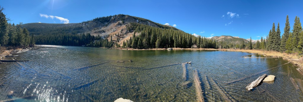 This is Lost Lake which can be found at the end of the Hessie Trail. It's a panoramic shot so you can see the whole length of the lake.