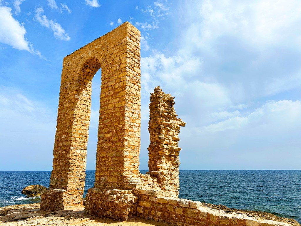 This old structure makes for a perfect frame with the sea behind you