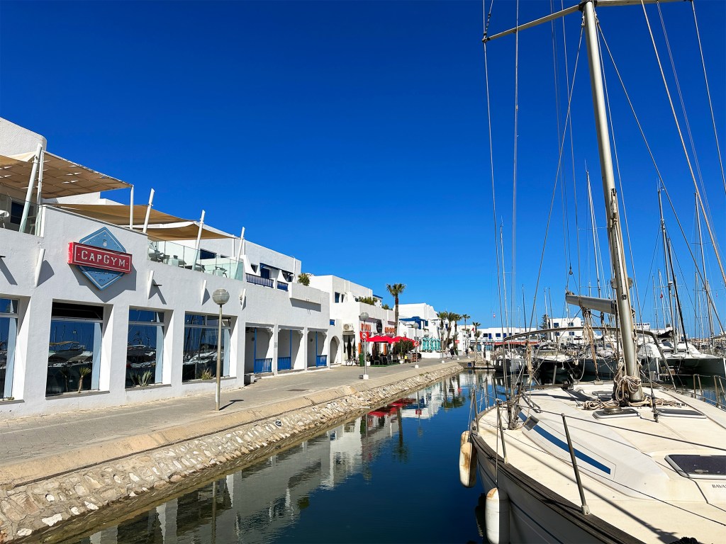 There are many sailboats in the Marina Cape in Monastir. Cafes too.