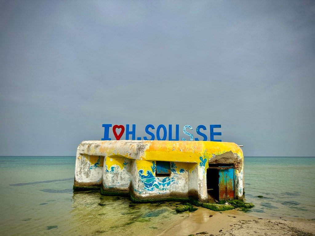 At the beach in Sousse, Tunisia, there is a small structure that says ILOVEHSOUSSE on top.