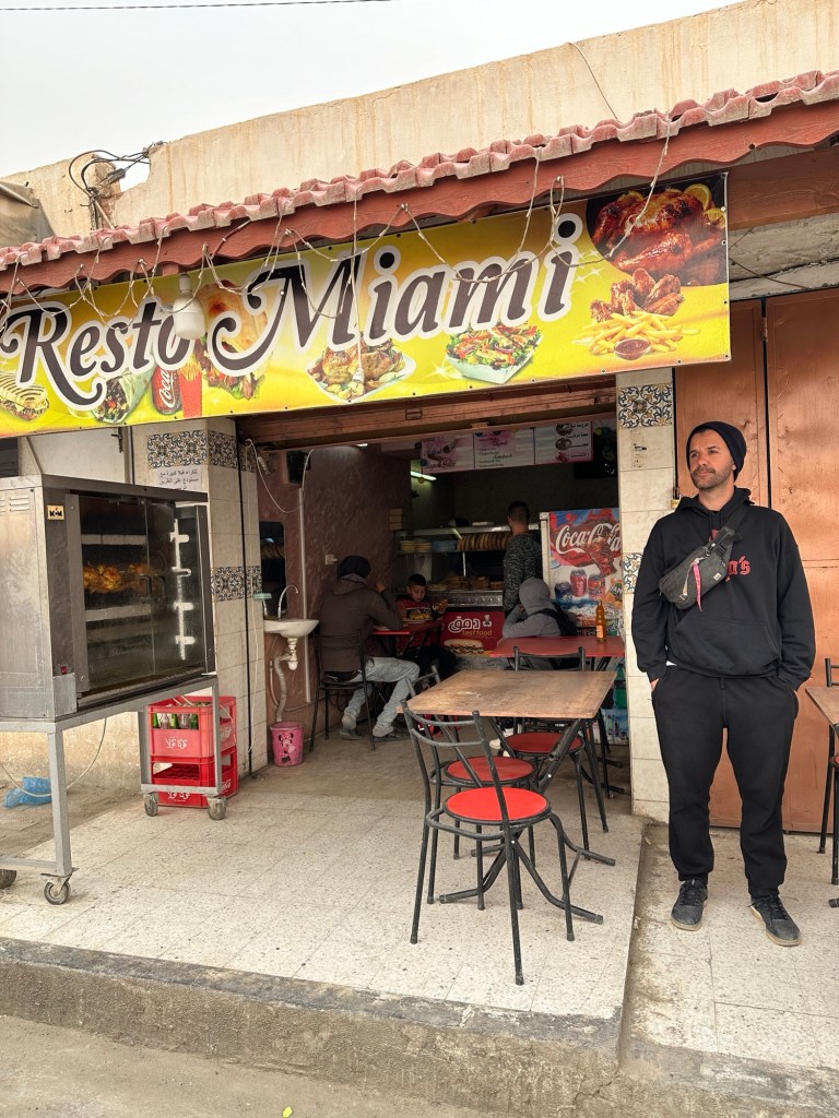Art stands in front of a small food shop where we stopped for lunch on our Tunisian road trip.