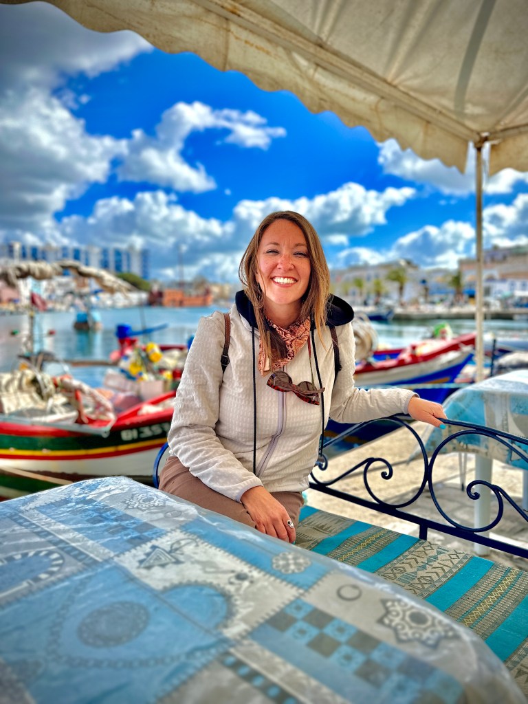 Nicki sits at an outdoor cafe in the old port in the town of Bizerte.